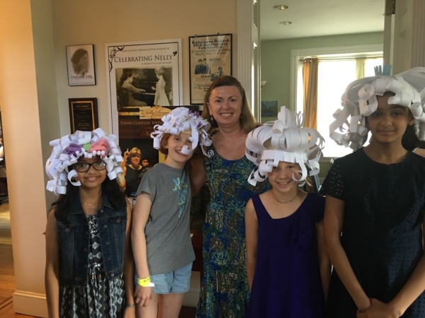 A group of people with their hair in curlers.