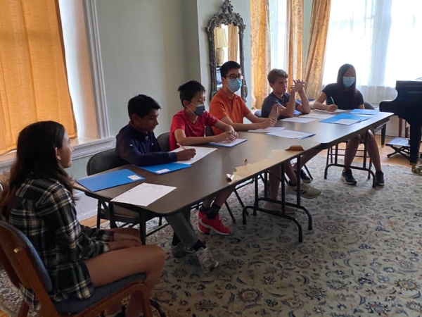 A group of people sitting at a table.